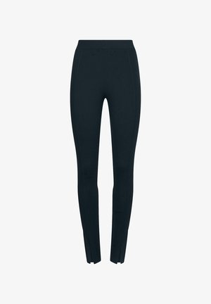 Sorte leggings med høj talje, lavet af strækbart stof. Har tilspidsede ben med sidesømme og små åbninger ved anklerne.
