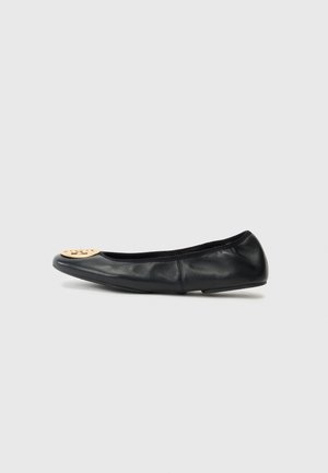 Black leather ballet flat with a rounded toe, featuring a gold hardware accent on the toe, smooth texture, and flexible sole.