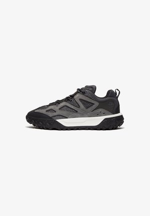 Dark gray hiking shoes with a textured mesh upper, rubber sole, and structured design. Features a white midsole and prominent tread pattern.