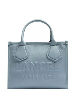 Sac à main en cuir bleu clair avec deux poignées et texte embossé "LANCEL PARIS 1876" sur le panneau avant.