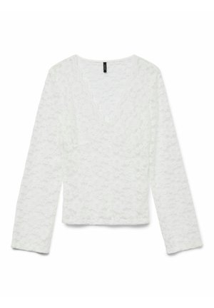 Top blanc à manches longues en dentelle avec un décolleté en V festonné et un motif floral texturé. Présente une coupe courte et des manches droites.