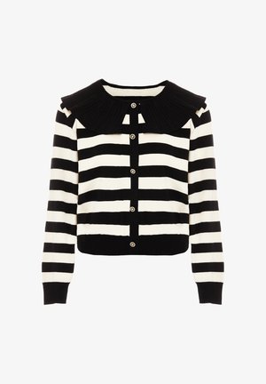 Musta-valkoinen raidallinen neuletakki, jossa on ribbireunalla varustettu musta kaulus, edessä napit ja pitkät hihat. Pehmeää neulosta, lyhyt malli.