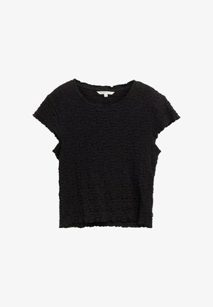 Fekete, rövid ujjú felső, texturált anyagból, gyűrött megjelenéssel. Kerek nyakkivágással és laza illeszkedéssel rendelkezik, aszimmetrikus szegéllyel.