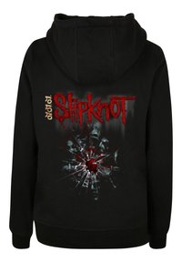 Black hoodie featuring a red "Slipknot" logo and a graphic design of a cracked surface with a red center and dark accents.
