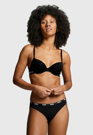 Schwarzer gepolsterter BH und passender String, aus glattem Material gefertigt, mit dünnen Trägern und einem Logo-Bund. Schlichtes, elegantes Design.