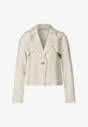 Linneblazer i krämfärg, med kilkrage, en enkel knäppning fram och stiliga, formade axlar utan synliga mönster.