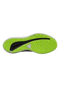 Suela de un zapato con una capa superior negra y gris y una parte inferior texturizada de color verde brillante que presenta un patrón en zigzag para una mayor tracción.