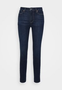 Mörkblå denimjeans med slim fit, som har en klassisk femfickorsdesign, metallknappstängning och minimal sömnad.