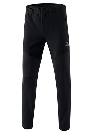 Pantalones deportivos negros hechos de material elástico, con un cinturón elástico y bolsillos laterales con cremallera. El diseño incluye paneles en contraste en los muslos.