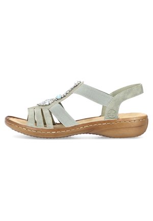 Light green sandal with multiple straps and decorative stones. Features a brown sole with a slight wedge, leather material, and elastic accents.