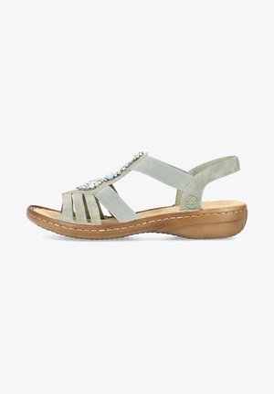 Light green sandal with multiple straps and decorative stones. Features a brown sole with a slight wedge, leather material, and elastic accents.