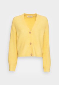 Cárdigan de punto amarillo con canalé, escote en V, mangas largas y diseño corto. Cuenta con cinco botones con un acabado suave.