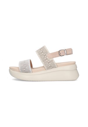 Sandalo beige con zeppa con cinturini traforati, fibbia regolabile alla caviglia e suola imbottita per il comfort.