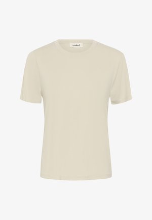 Preprosta bež kratka majica z okroglim izrezom in majhno oznako "soaked" na notranji strani ovratnika, prikazana na belem ozadju.