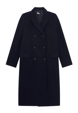 Cappotto doppiopetto navy in misto lana, con grandi bottoni, revers a punta e due tasche frontali. Tessuto liscio con vestibilità lunga e dritta.