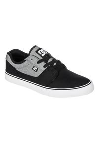 Black and gray canvas sneaker with lace-up design, white rubber sole, black accents, and a gray textured fabric on the upper.