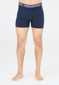 Navy blue boxer shorts made of soft fabric, featuring a wide elastic waistband with "ENDURANCE" printed in light purple.