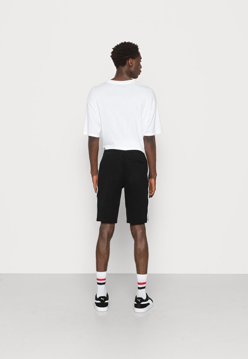 Herren Trainingsanzüge | Calvin Klein Jeans CONTRAST TAPE HWK Jogginghose ck black/schwarz - NU25013 Herren Trainingsanzüge | Calvin Klein Jeans CONTRAST TAPE HWK Jogginghose ck black/schwarz - NU25013