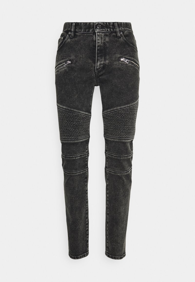 Černé džíny z denimu s úzkým střihem, zipovými kapsami, strukturovanými panely na kolenou a vybledlým efektem.