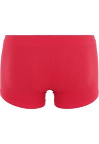Röda badshorts med en åtsittande passform, slät yta och elastisk midja. Minimalistisk design utan ytterligare mönster eller detaljer.