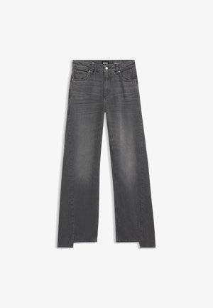 Jeans in denim grigio con taglio a gamba larga, caratterizzati da un classico design a cinque tasche e da una leggera scoloritura su tutto il tessuto.