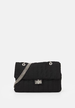 Black quilted handbag with a silver chain shoulder strap and a front clasp detail. Features a soft texture and structured rectangular shape.