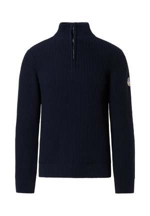 Suéter azul marino hecho de tejido acanalado, con un alto cuello con cremallera y un parche con el logo en la manga izquierda.