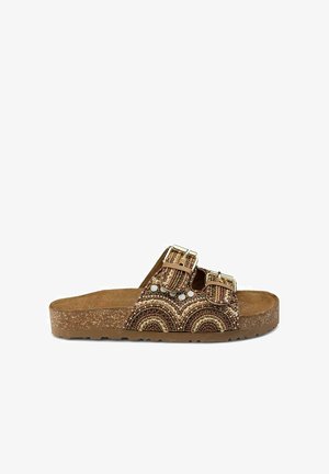 Brown cork slide sandal with dual buckle straps, featuring a beaded design in earth tones and white accents on the upper surface.