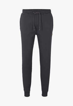 Harmaat collegehousut pehmeästä kankaasta, joissa on joustava vyötärönauha nyörillä, resorit lahkeensuissa ja pieni logoyksityiskohta.