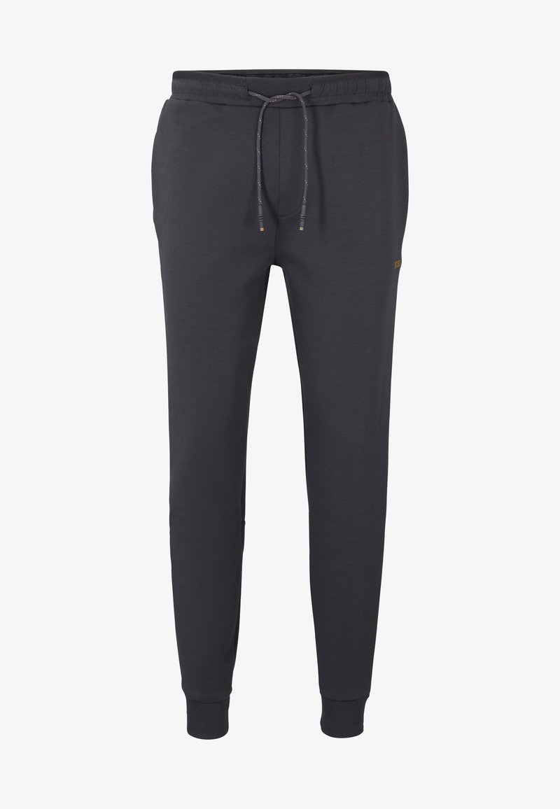 Grå joggingbukser lavet af blødt stof med elastisk talje og snøre, ribbede manchetter og en lille logoaccent.