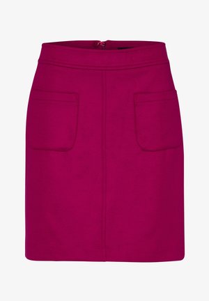 Fuksjowa bawełniana spódnica o prostym kroju, z dwoma przednimi kieszeniami i zapięciem na zamek z tyłu. Gładka faktura i jednolity kolor.