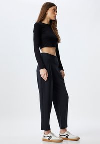 Koton MODAL - Pantalones - black