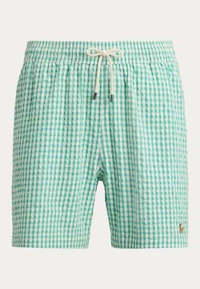 Rohelise ja valge ruudulise mustriga ujumispüksid, millel on elastne vöökoht, valge kinnituspael ning vasakul jalal väike tikitud hobuse logo.