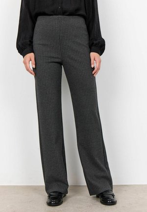 High-waisted, wide-leg trousers in dark grey with thin white pinstripes, made of textured fabric. Paired with black glossy loafers.