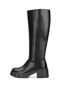 Black knee-high boots made of smooth faux leather, rounded toe, chunky heel, and textured rubber sole with cut-out accents.