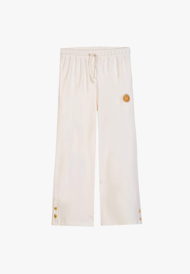 Pantaloni a gamba larga color crema con vita elastica, coulisse, dettagli con bottoni dorati vicino all'orlo e un piccolo logo rotondo sulla coscia destra.