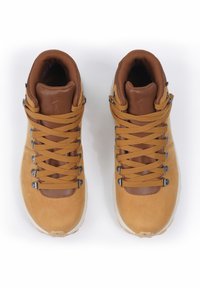 Brown leather hiking shoes with tan suede, flat laces, and metallic accent eyelets. High-top design with cushioned ankle support.