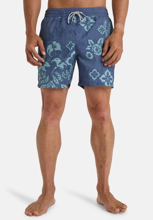 Pantalones cortos de baño de estampado floral azul, hechos de material ligero, que cuentan con una cinturilla con cordón y un acabado texturizado con patrones tropicales.