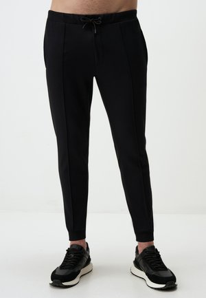 WITH ELASTIC WAISTBAND - Pantalon de survêtement - black