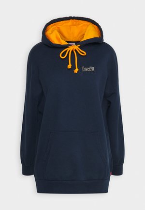 Temno moder pulover z žametno ž yellow oblečeno kapuco, nastavljivimi vrvicami in sprednjim žepom. Ima majhen vezen logo.