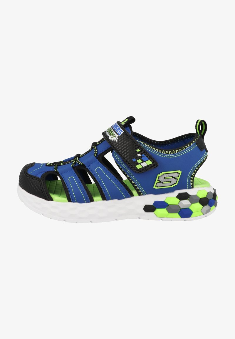 Blue and black sporty sandal with mesh upper, adjustable Velcro strap, hexagonal patterned sole, and bright green accents.