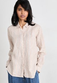 Striped button-up shirt in light fabric; features soft peach and cream vertical stripes, collar, and long sleeves. Classic fit and rounded hem.