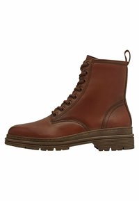 Bottines en cuir marron avec un bout arrondi, un laçage et une semelle en caoutchouc texturée. Elles possèdent un talon et une languette à l'arrière pour un enfilage facile.