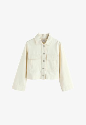 Kreemikas kärbitud jakk kraega, ees nööpidega, kahe klapiga tasku ja pikkade varrukatega.