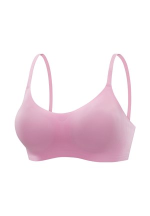 Light pink seamless bra with thin adjustable straps, smooth texture, and molded cups for a supportive fit. No visible hardware or embellishments.