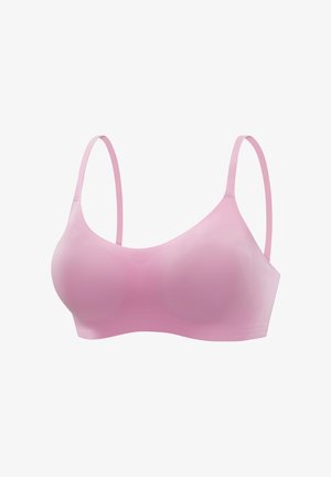 Light pink seamless bra with thin adjustable straps, smooth texture, and molded cups for a supportive fit. No visible hardware or embellishments.