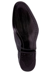 Suola in pelle nera con finitura liscia e lucida. Presenta un tacco arrotondato, cuciture decorative e accenti in gomma per migliorare la trazione.
