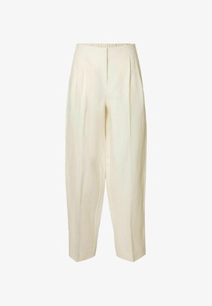 Hlače iz lanenega blaga kremaste barve z ohlapnim krojem, ki imajo sprednje pregibe in elastičen pas, gladko teksturo in zožene gležnje.