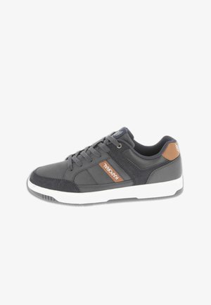 Dark gray low-top sneaker with brown accents, white sole, lace-up front, and a "Kaporal" label on the side.