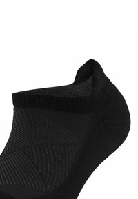 Calza nera alla caviglia con modelli a maglia testurizzati, punta senza cuciture e tallone rinforzato. Tessuto morbido ed elastico progettato per il comfort e la vestibilità.